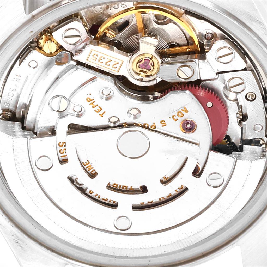 The image shows a close-up view of the movement mechanism of a Rolex Datejust 79174 Women
s Stainless Steel Silver Dial 79174 Women
s Stainless Steel Silver Dial watch.