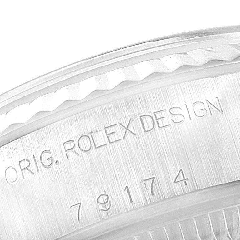 This image shows a close-up of the side engraving on a Rolex Datejust 79174 Women
s Stainless Steel Silver Dial 79174 Women
s Stainless Steel Silver Dial watch.