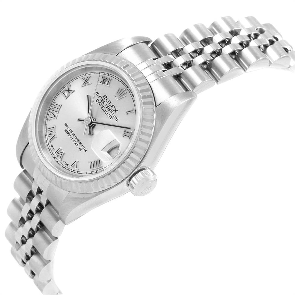 The Rolex Datejust 79174 Women
s Stainless Steel Silver Dial 79174 Women
s Stainless Steel Silver Dial watch is shown at an angled side view, displaying its dial, fluted bezel, and Jubilee bracelet.