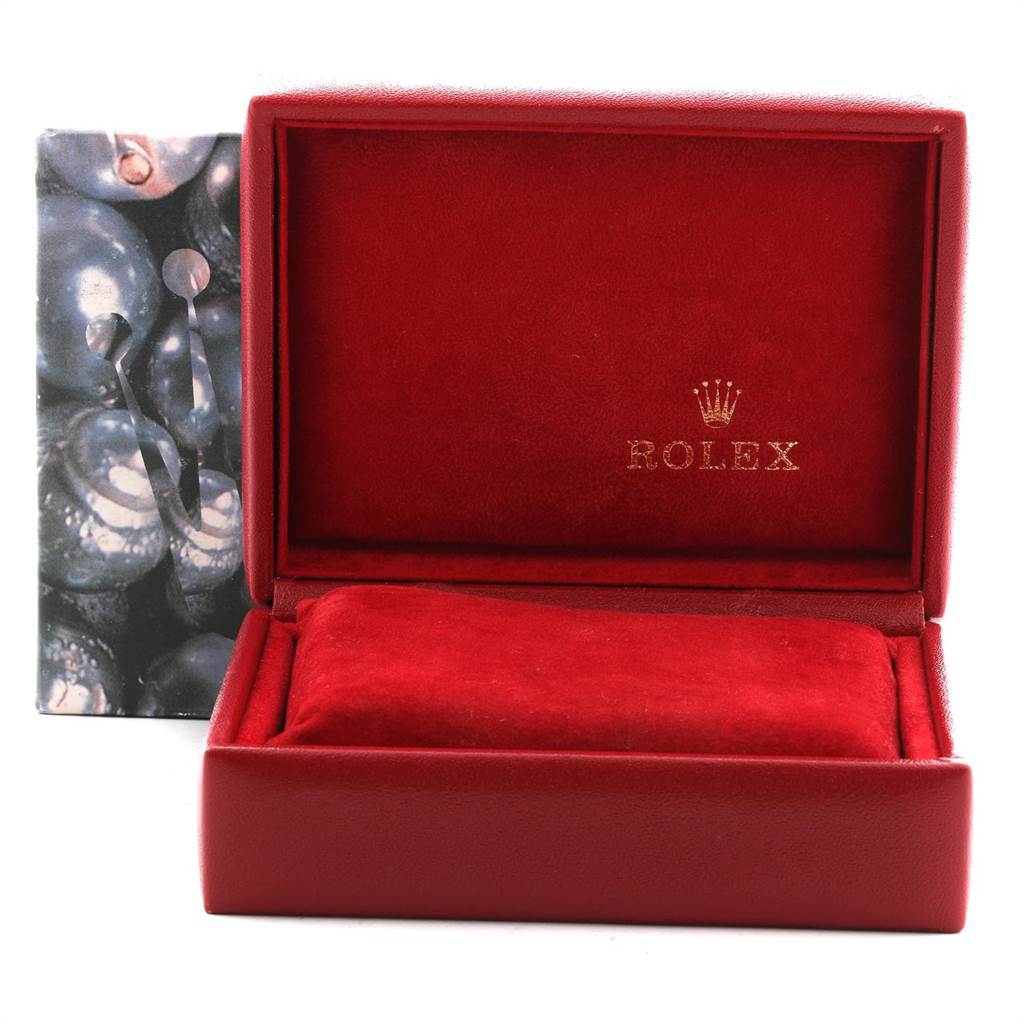 The image shows an open Rolex Datejust 79174 Women's Stainless Steel Blue Dial 79174 Women's Stainless Steel Blue Dial watch box, with a red interior and the Rolex logo on the inside lid.