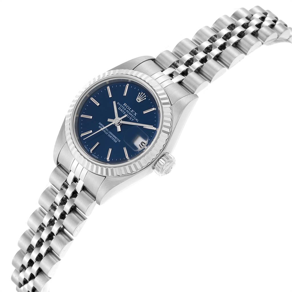 The image shows a Rolex Datejust 79174 Women's Stainless Steel Blue Dial 79174 Women's Stainless Steel Blue Dial watch at a slight angle, highlighting its blue dial, fluted bezel, and Jubilee bracelet.