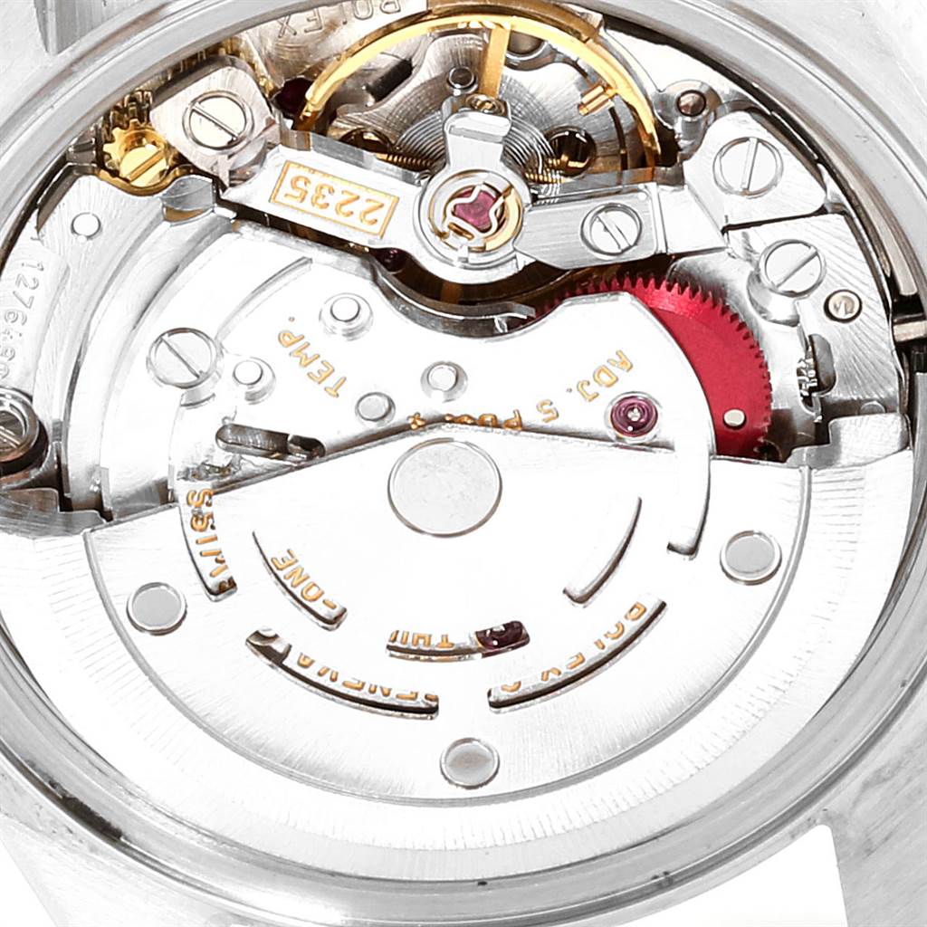 This image shows a close-up of the movement mechanism of a Rolex Datejust 79174 Women
s Stainless Steel Silver Dial 79174 Women
s Stainless Steel Silver Dial watch.