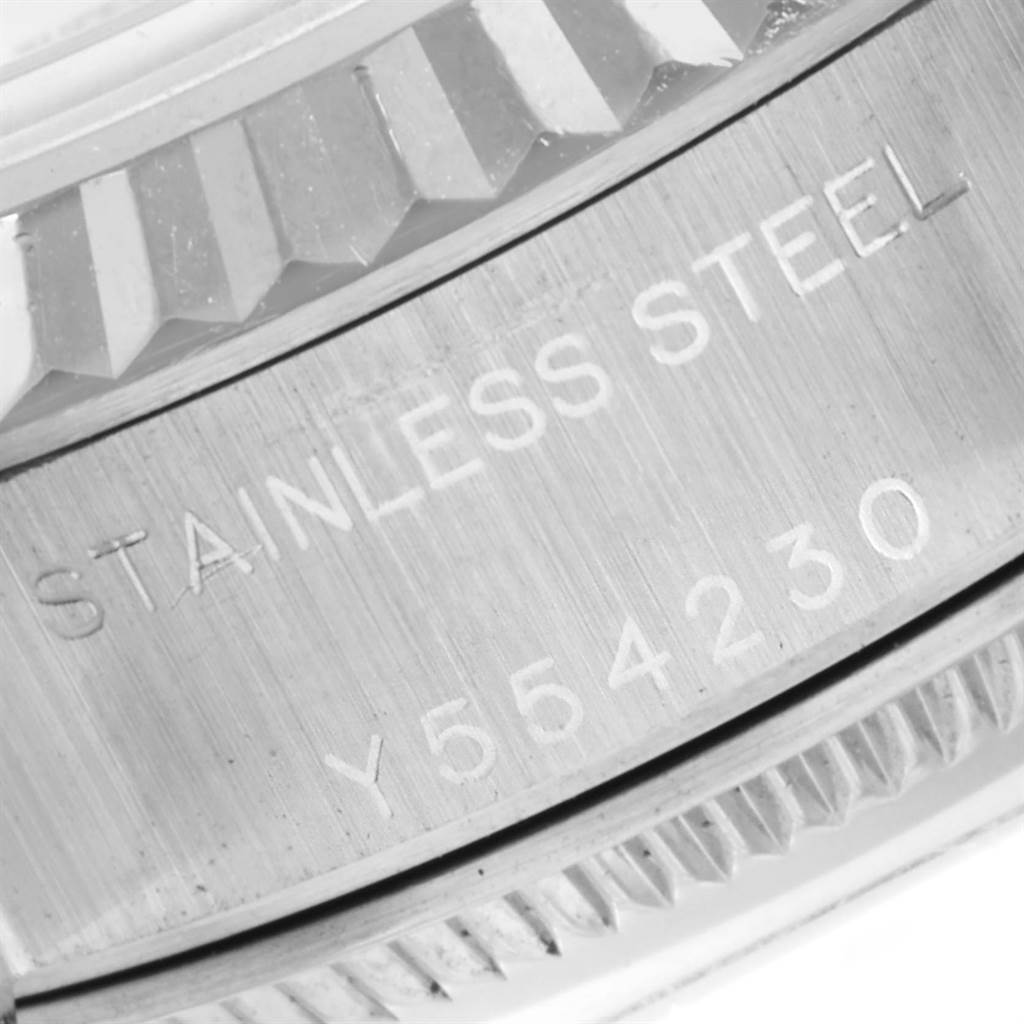 The image shows a close-up view of the model and serial number engraving on the stainless steel side of a Rolex Datejust 79174 Women
s Stainless Steel Silver Dial 79174 Women
s Stainless Steel Silver Dial watch.