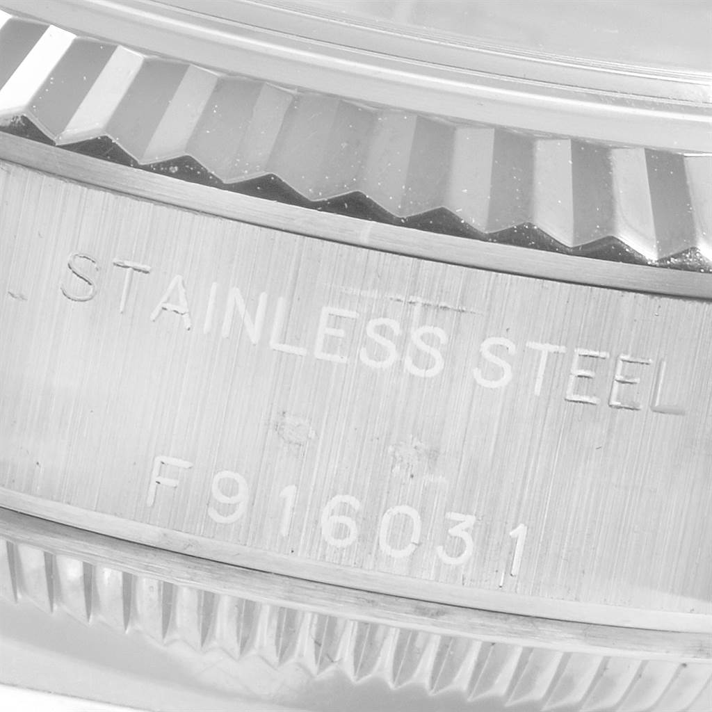 Close-up of the Rolex Datejust 79174 Women
s Stainless Steel Silver Dial 79174 Women
s Stainless Steel Silver Dial model, focusing on the fluted bezel and engraved stainless steel caseback.