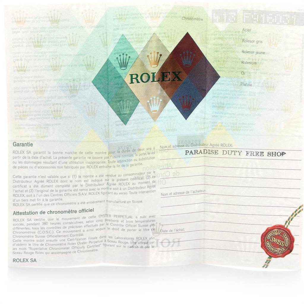 The image shows an unfolded Rolex Datejust 79174 Women
s Stainless Steel Silver Dial 79174 Women
s Stainless Steel Silver Dial warranty certificate with a colorful diamond pattern and warranty details.