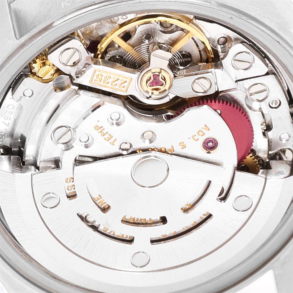 This image shows a close-up view of the movement and inner mechanisms of a Rolex Datejust 79174 Women's Stainless Steel Pink Dial 79174 Women's Stainless Steel Pink Dial watch.
