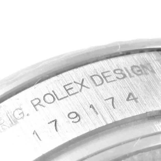 The image shows a close-up of the engraving on the bezel of a Rolex Datejust 179174 Women's Stainless Steel Mother of Pearl Dial 179174 Women's Stainless Steel Mother of Pearl Dial watch.