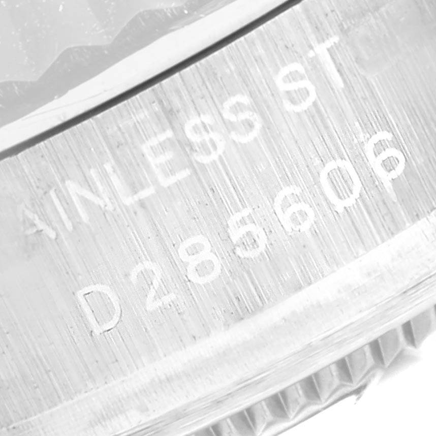 The image shows a close-up view of the serial number and 'STAINLESS STEEL' engraving on a Rolex Datejust 179174 Women's Stainless Steel Mother of Pearl Dial 179174 Women's Stainless Steel Mother of Pearl Dial watch.