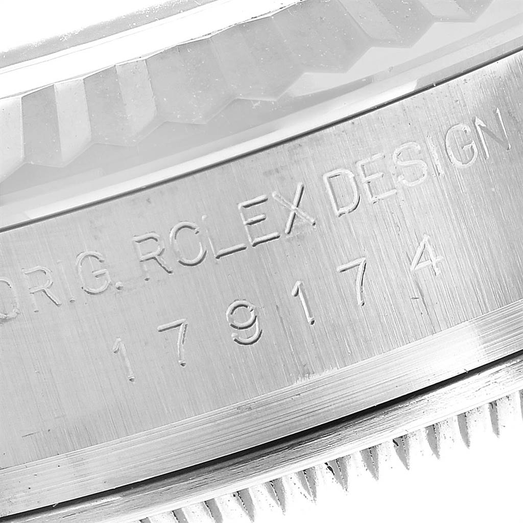 This close-up image shows the engraved caseback and fluted bezel of a Rolex Datejust 179174 Women
s Stainless Steel Mother of Pearl Dial 179174 Women
s Stainless Steel Mother of Pearl Dial model.