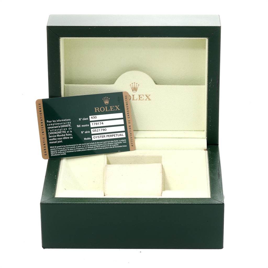 The image shows an empty Rolex Datejust 179174 Women
s Stainless Steel Mother of Pearl Dial 179174 Women
s Stainless Steel Mother of Pearl Dial watch box and its warranty card, viewed from the front angle.