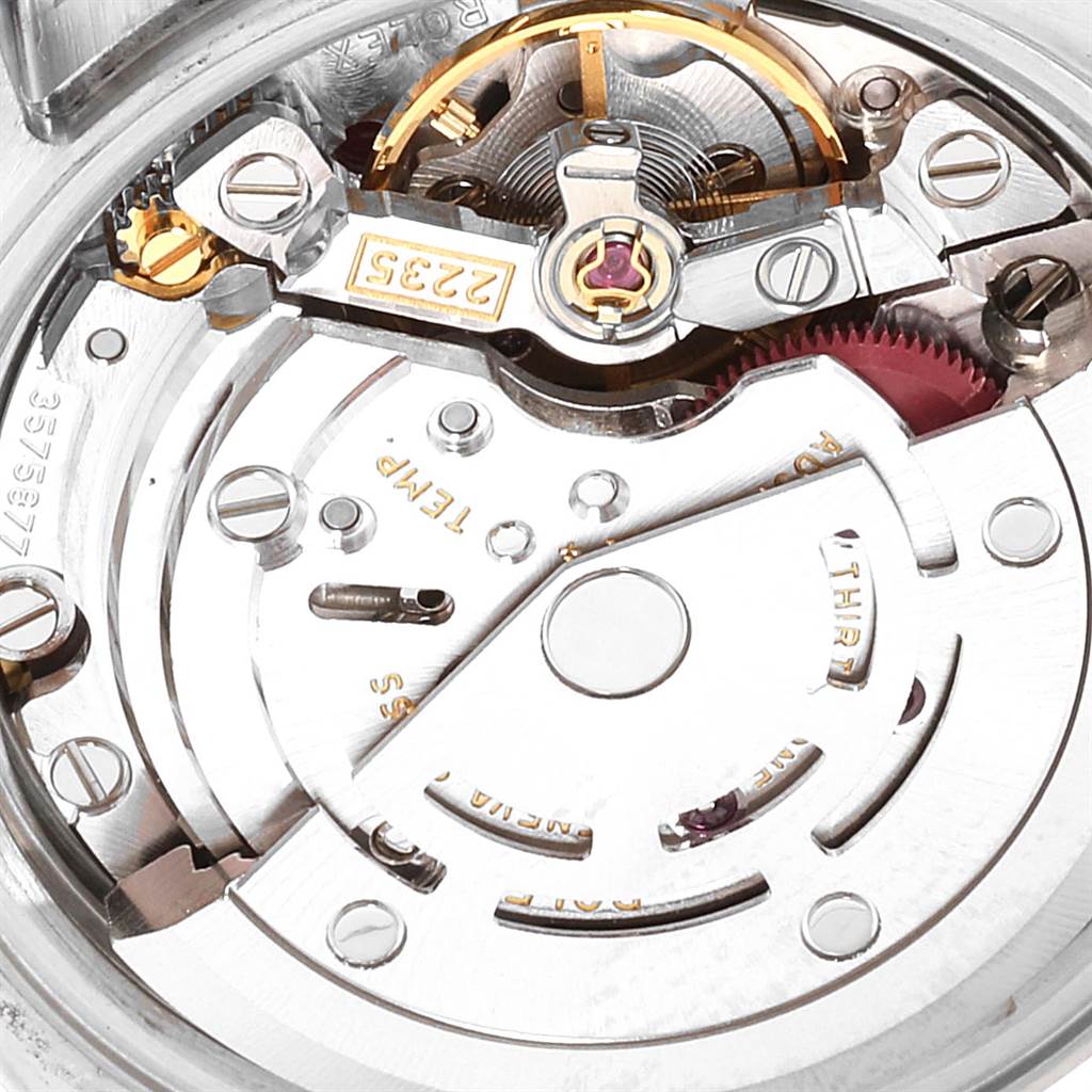 This is a close-up view of the movement of a Rolex Datejust 179174 Women
s Stainless Steel Mother of Pearl Dial 179174 Women
s Stainless Steel Mother of Pearl Dial watch, showcasing its intricate components and mechanisms.