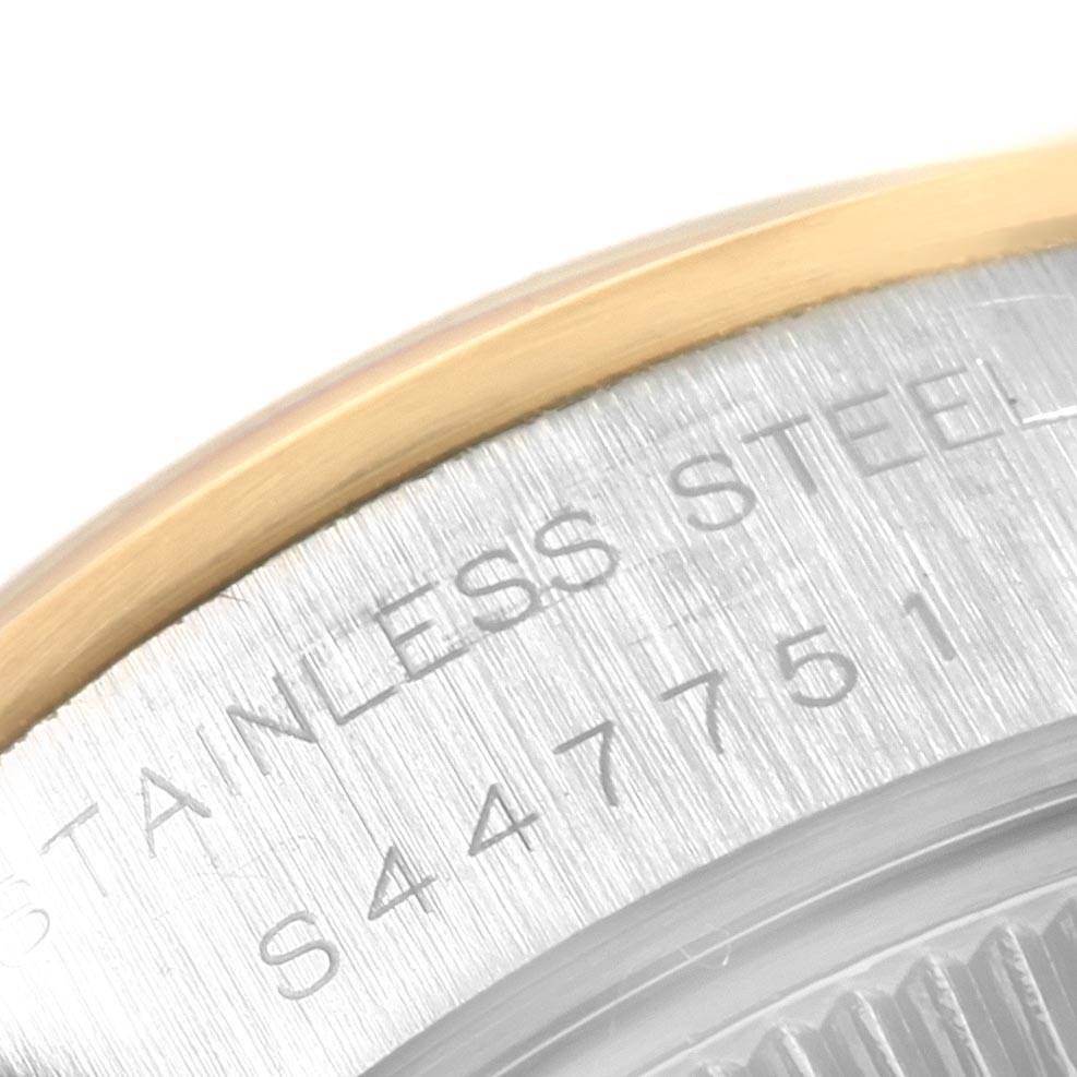 The image shows a close-up of the stainless steel case back and gold bezel of a Rolex Datejust 69163 Women's Stainless Steel Beige Dial 69163 Women's Stainless Steel Beige Dial watch.