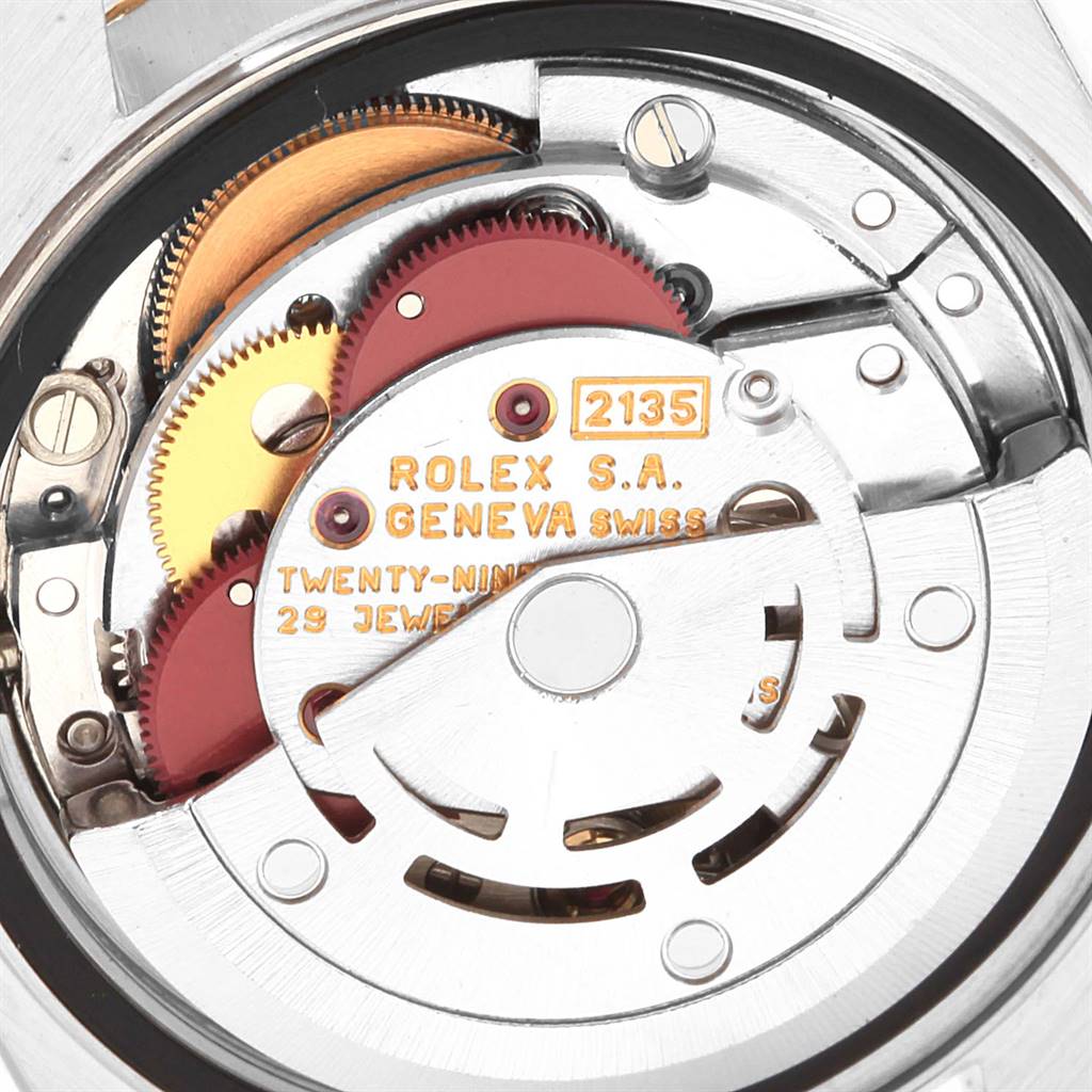 This image shows a close-up view of the Rolex Datejust 69163 Women's Stainless Steel Beige Dial 69163 Women's Stainless Steel Beige Dial movement's internal mechanisms, including gears and the rotor.