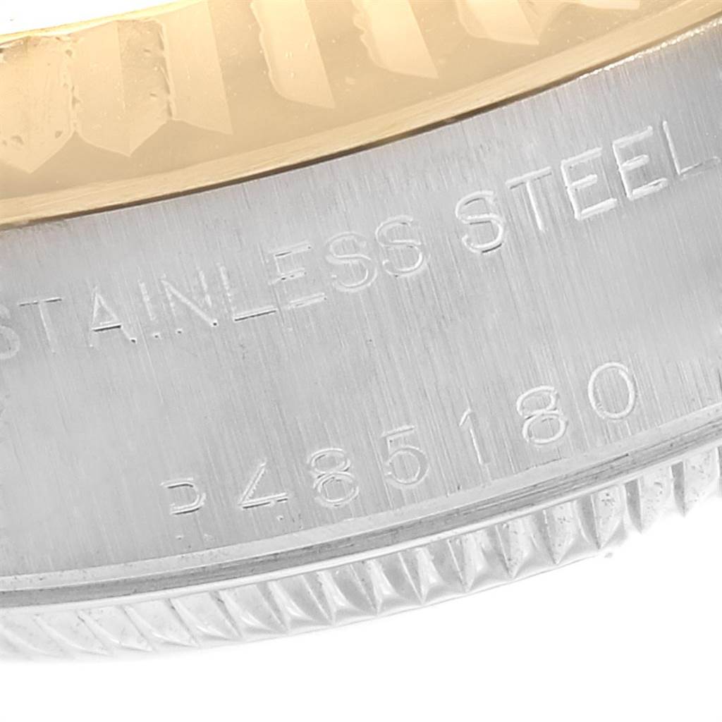 This close-up image shows the stainless steel case back and the edge of the fluted bezel of a Rolex Datejust 79173 Women's Steel and Gold (two tone) Grey Dial 79173 Women's Steel and Gold (two tone) Grey Dial watch.