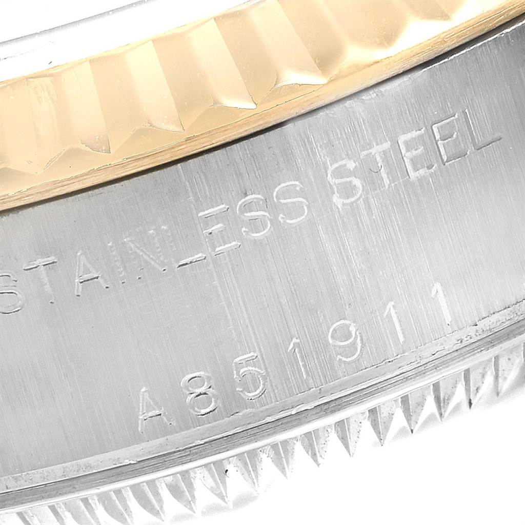 The image shows a close-up of the casing side of a Rolex Datejust 79173 Women
s Steel and Gold (two tone) Blue Dial 79173 Women
s Steel and Gold (two tone) Blue Dial, highlighting the stainless steel and part of the bezel.