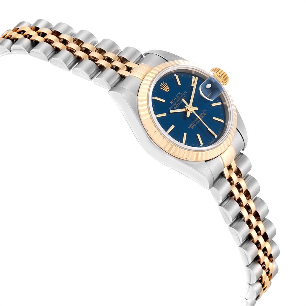 The image shows a Rolex Datejust 79173 Women
s Steel and Gold (two tone) Blue Dial 79173 Women
s Steel and Gold (two tone) Blue Dial watch angled to highlight its bezel, crown, jubilee bracelet, and blue dial.
