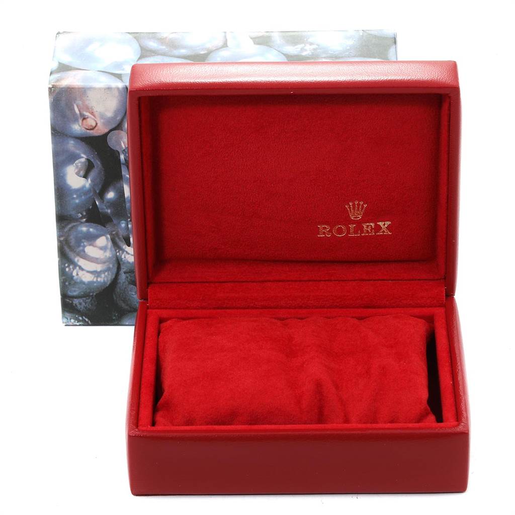 This image shows an open red Rolex box for the Datejust model with a cushion inside.