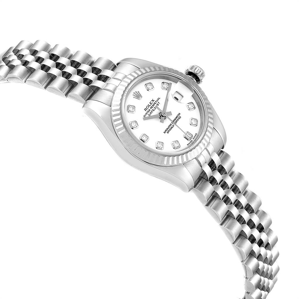This is a Rolex Datejust 179174 Women
s Stainless Steel White Dial 179174 Women
s Stainless Steel White Dial watch shown at an angled side view, displaying its dial, fluted bezel, and jubilee bracelet.