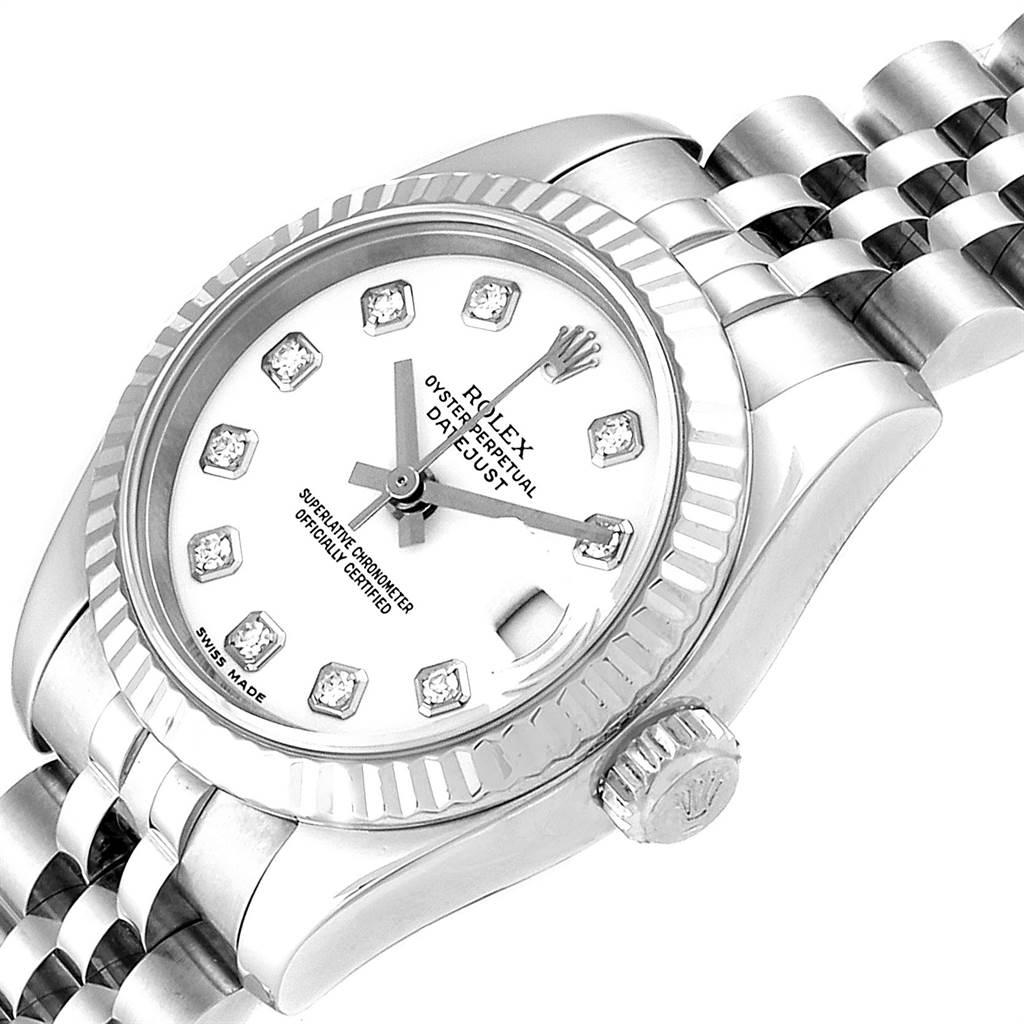 This is an angled close-up of a Rolex Datejust 179174 Women
s Stainless Steel White Dial 179174 Women
s Stainless Steel White Dial watch, showing its white dial, diamond markers, fluted bezel, and part of the jubilee bracelet.