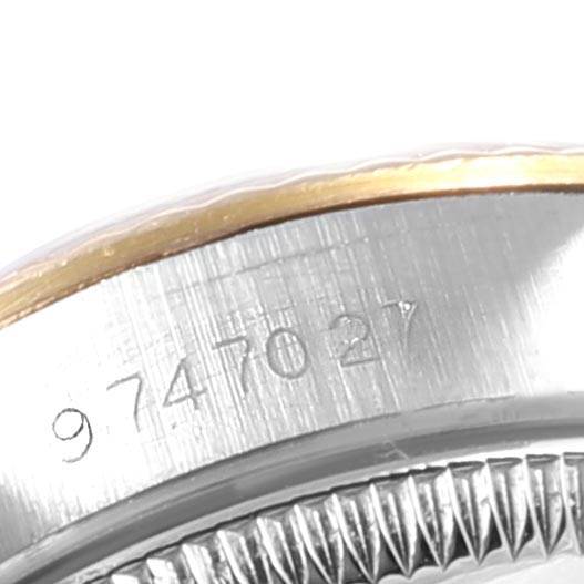 The image shows a close-up of the serial number and fluted bezel of a Rolex Datejust 67193 Women's Steel and Gold (two tone) Champagne Dial 67193 Women's Steel and Gold (two tone) Champagne Dial watch.