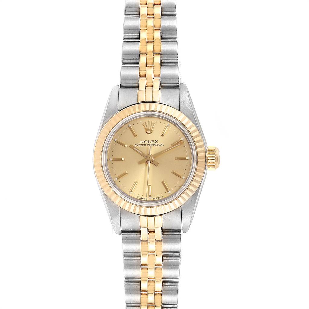 The Rolex Datejust 67193 Women's Steel and Gold (two tone) Champagne Dial 67193 Women's Steel and Gold (two tone) Champagne Dial watch is shown from a top-down angle, featuring a two-tone bracelet, gold dial, and fluted bezel.
