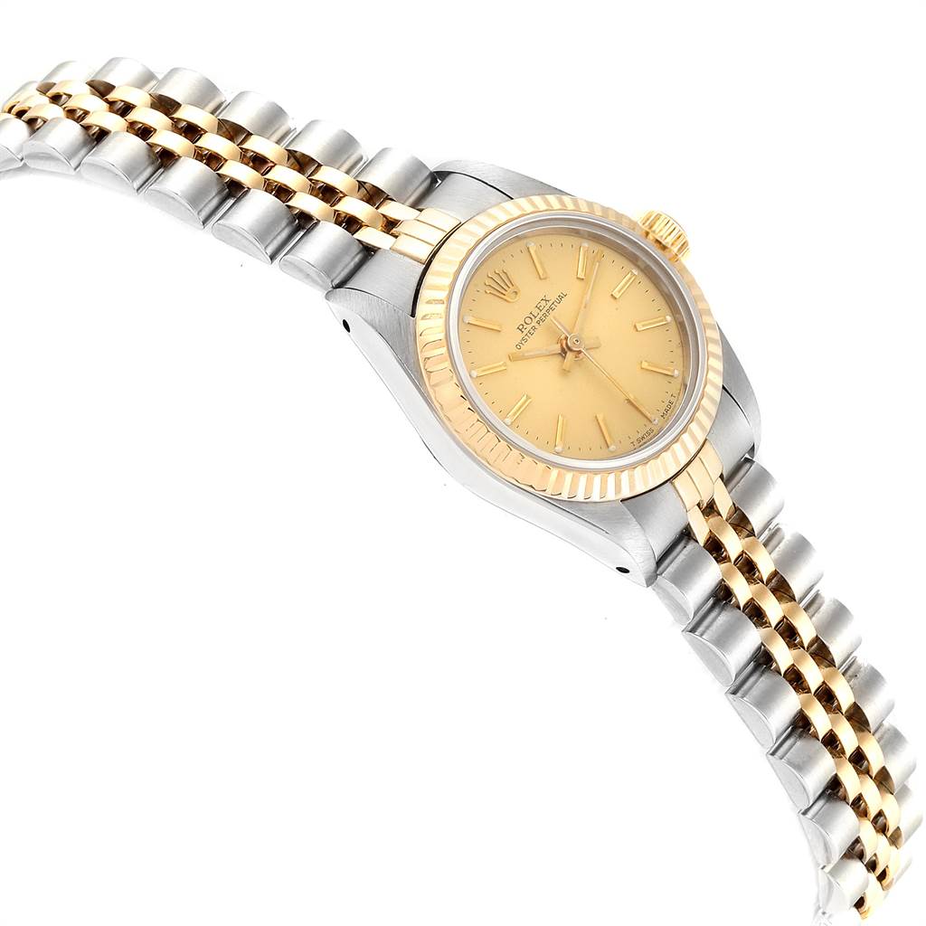 The Rolex Datejust 67193 Women's Steel and Gold (two tone) Champagne Dial 67193 Women's Steel and Gold (two tone) Champagne Dial watch is shown at a slight side angle, highlighting its two-tone metal bracelet, gold bezel, and champagne dial.