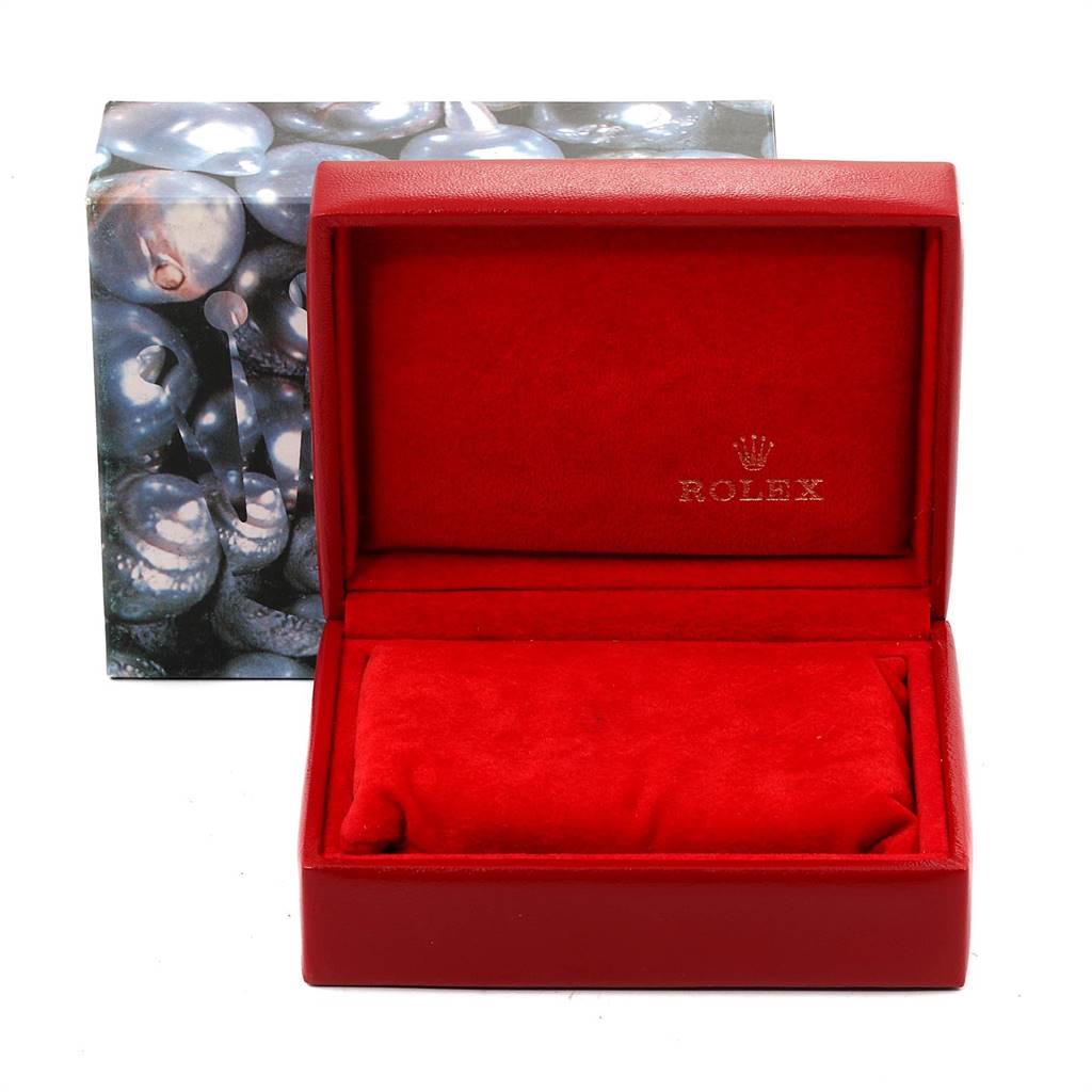 The image shows an empty red Rolex Datejust 69173 Women's Stainless Steel White Dial 69173 Women's Stainless Steel White Dial watch box with its lid open, revealing a red interior.