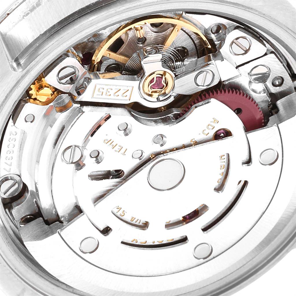 This is a close-up view of the inner mechanical movement of a Rolex Datejust 179171 Women's Steel and Gold (two tone) Silver Dial 179171 Women's Steel and Gold (two tone) Silver Dial watch, showing gears and intricate components.