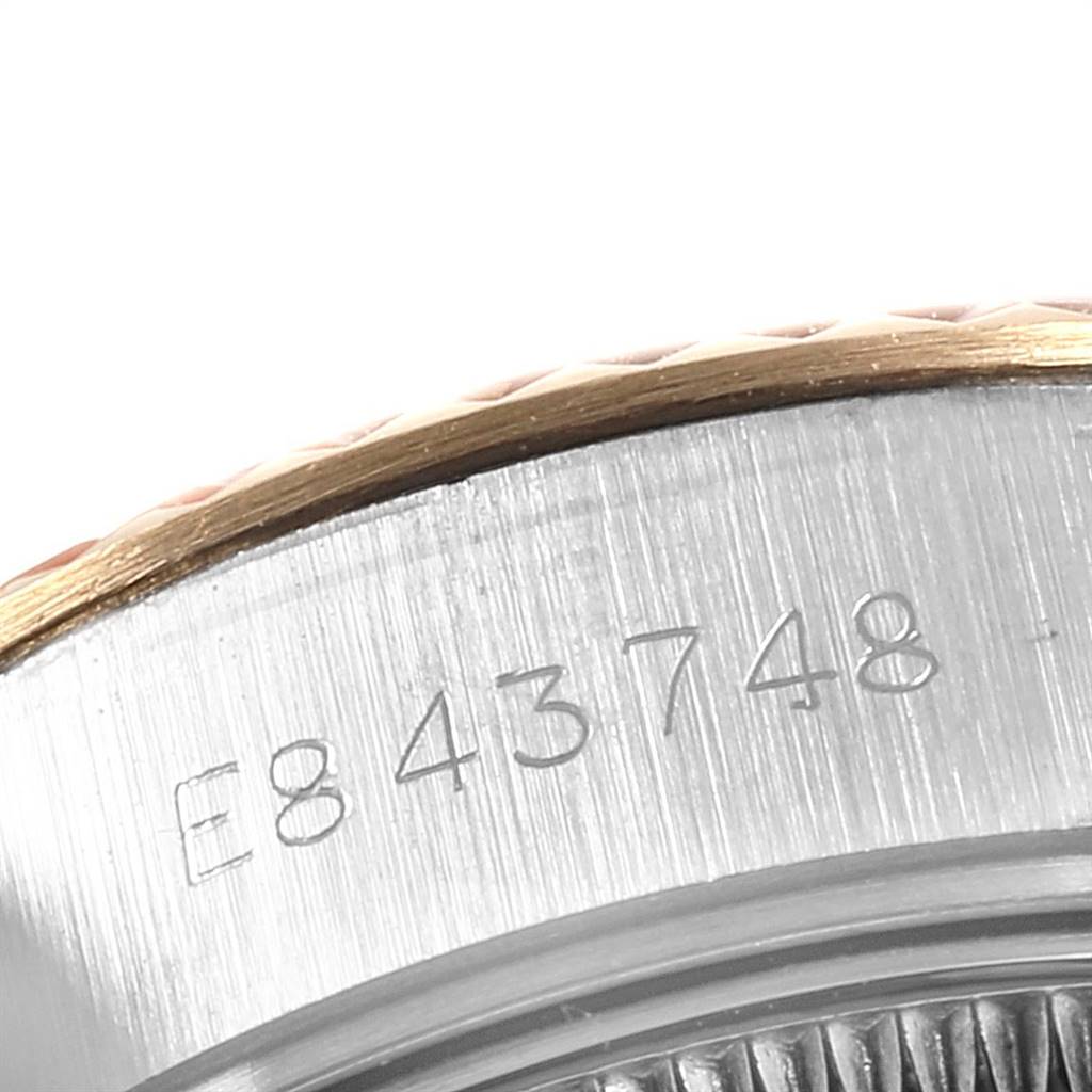 This image shows the serial number engraved on the side of the case of a Rolex Datejust 69173 Women's Stainless Steel White Dial 69173 Women's Stainless Steel White Dial watch.