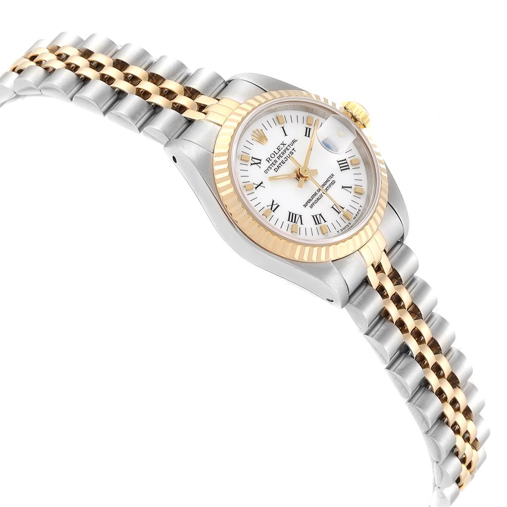 This Rolex Datejust 69173 Women's Stainless Steel White Dial 69173 Women's Stainless Steel White Dial watch is shown at an angled view, highlighting its gold and silver bracelet, white dial, and fluted gold bezel.