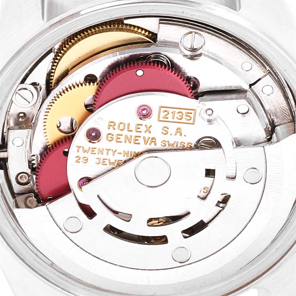 The image shows the inner mechanical movement of a Rolex Datejust 69173 Women's Stainless Steel Champagne Dial 69173 Women's Stainless Steel Champagne Dial model, focusing on the gears and inscriptions.