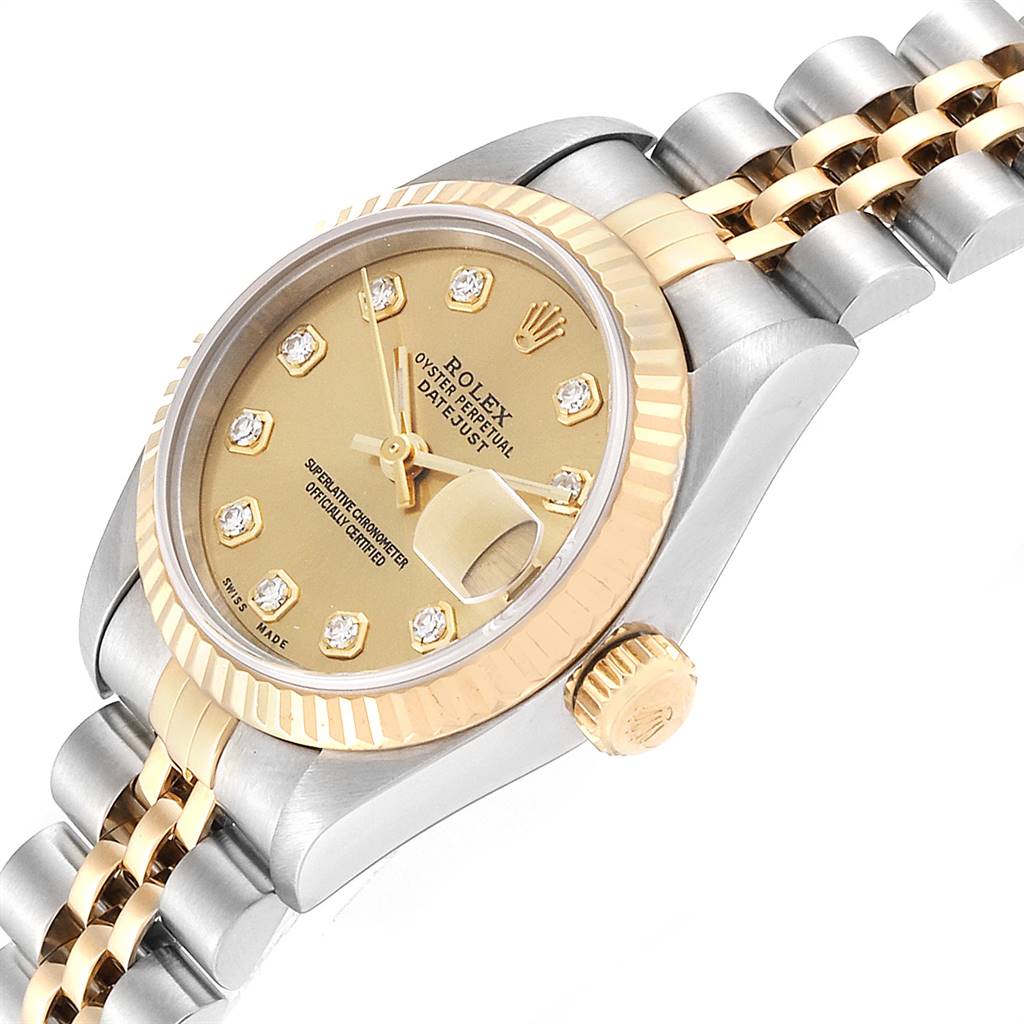 The Rolex Datejust 69173 Women's Stainless Steel Champagne Dial 69173 Women's Stainless Steel Champagne Dial watch is shown at a slight top angle, displaying its fluted bezel, crown, bracelet, and champagne diamond dial.