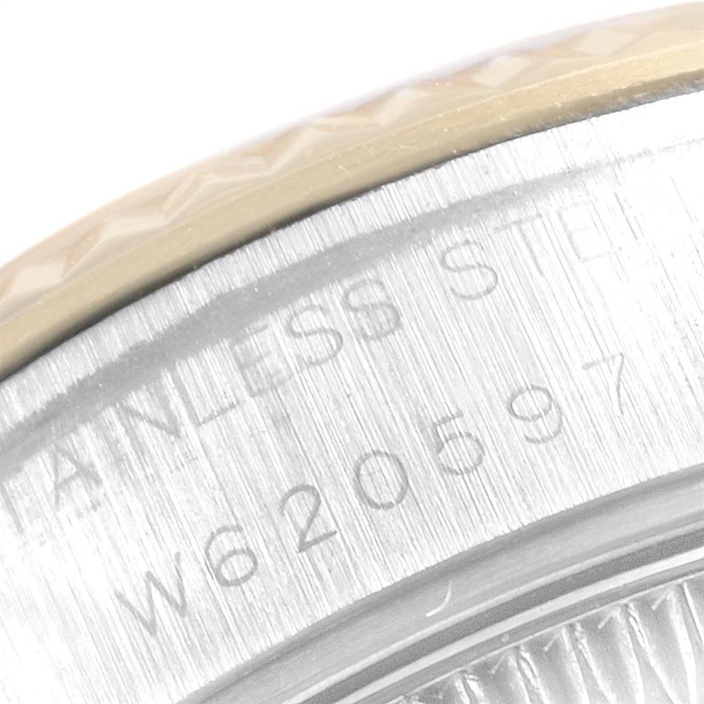 The image shows a close-up angle of the case back and serial number engraving of a Rolex Datejust 69173 Women's Stainless Steel Champagne Dial 69173 Women's Stainless Steel Champagne Dial watch.