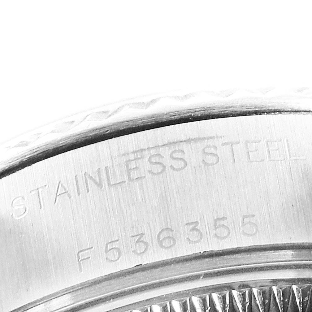 This close-up image shows the engraving on the side of a Rolex Datejust 79174 Women's Stainless Steel Mother of Pearl Dial 79174 Women's Stainless Steel Mother of Pearl Dial watch case, featuring "STAINLESS STEEL" and serial number "F536355."