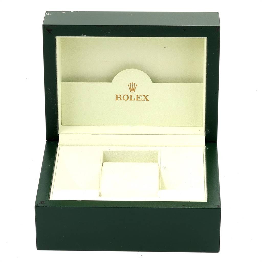 This image shows an empty green Rolex Datejust 79174 Women's Stainless Steel Mother of Pearl Dial 79174 Women's Stainless Steel Mother of Pearl Dial watch box, open to reveal its cream-colored interior.