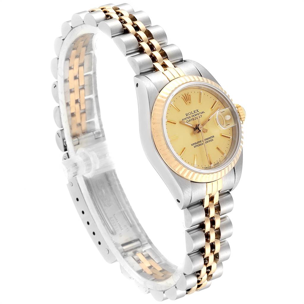 The Rolex Datejust 69173 Women's Stainless Steel Champagne Dial 69173 Women's Stainless Steel Champagne Dial watch is shown from a three-quarter side angle, highlighting the dial, bracelet, and fluted bezel.