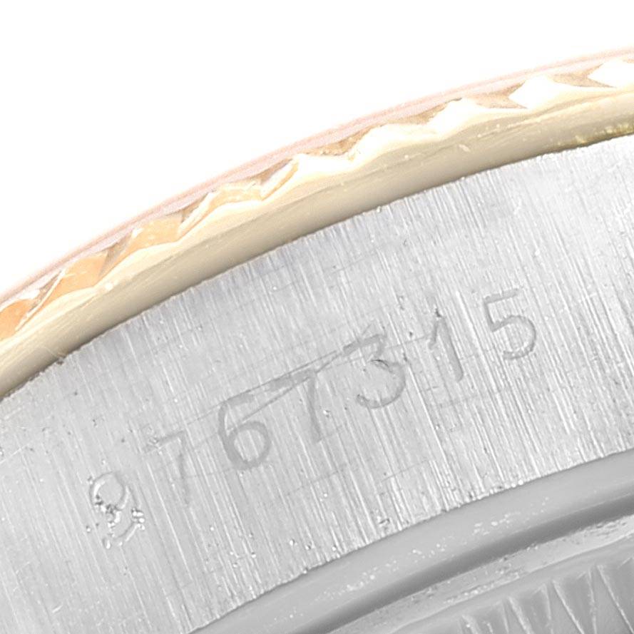 This image shows a close-up of the serial number and part of the bezel on a Rolex Datejust 69173 Women's Stainless Steel Champagne Dial 69173 Women's Stainless Steel Champagne Dial watch.