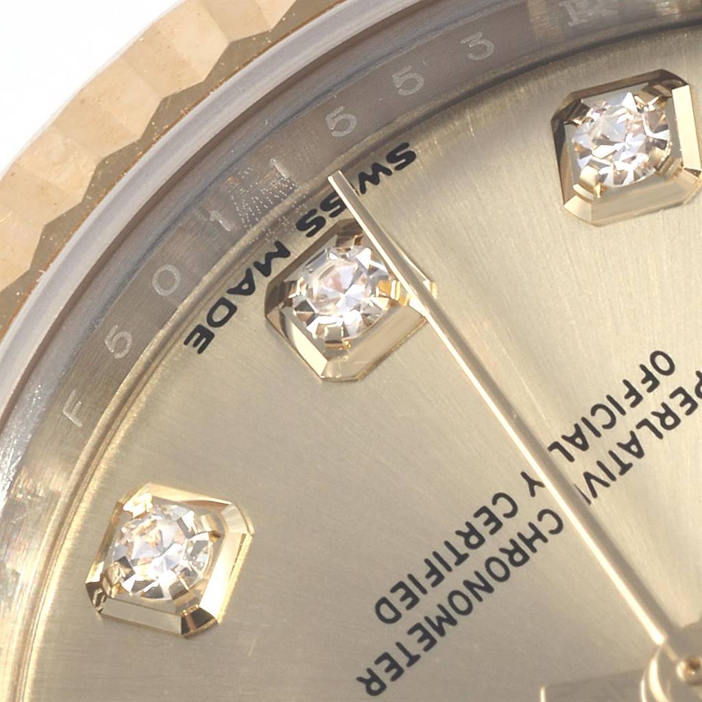 This is a close-up of the Rolex Datejust 279173 Women's Steel and Gold (two tone) Champagne Dial 279173 Women's Steel and Gold (two tone) Champagne Dial watch face, showing diamond hour markers and part of the text.