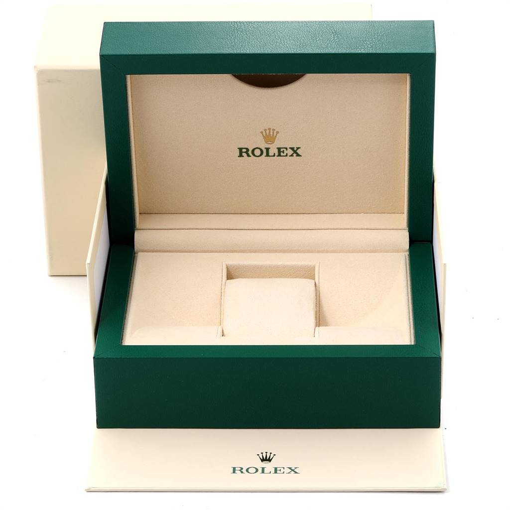 The image shows an empty green and beige Rolex Datejust 279173 Women's Steel and Gold (two tone) Champagne Dial 279173 Women's Steel and Gold (two tone) Champagne Dial watch box with the lid open, displaying the brand's logo.