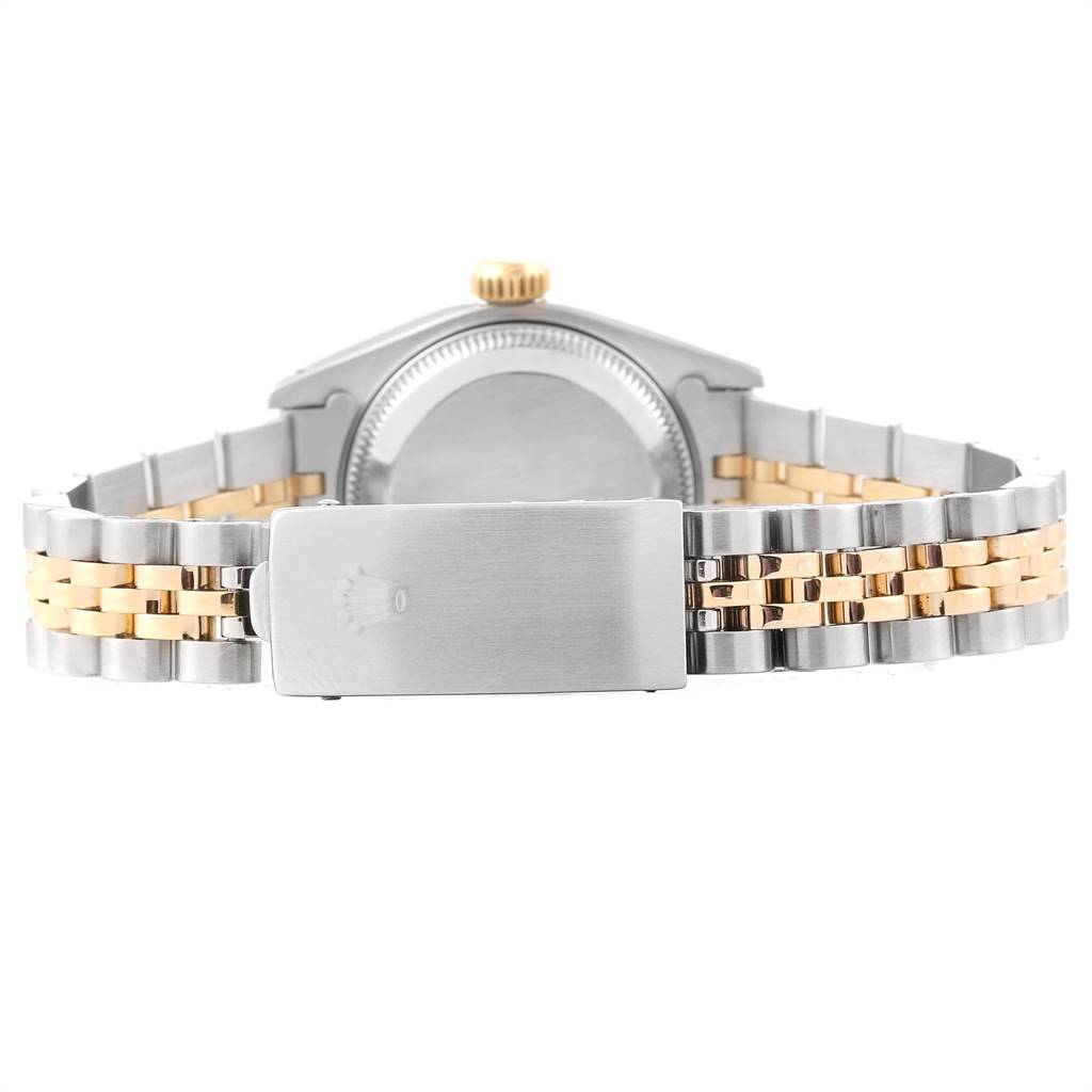 The image shows the back view of a Rolex Datejust 69173 Women's Stainless Steel Champagne Dial 69173 Women's Stainless Steel Champagne Dial watch, highlighting its case back, gold crown, and two-tone bracelet.