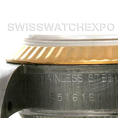 This close-up image shows a portion of a Rolex Datejust 69173 Women's Stainless Steel  69173 Women's Stainless Steel  watch, highlighting the stainless steel case and partial view of the bezel.