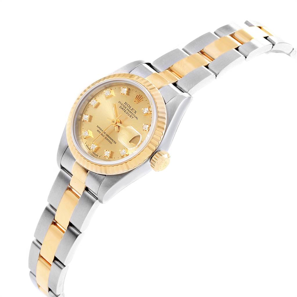 This image shows a Rolex Datejust 79173 Women's Stainless Steel Champagne Dial 79173 Women's Stainless Steel Champagne Dial watch at an angle displaying its face, bezel, crown, and two-tone metal bracelet.