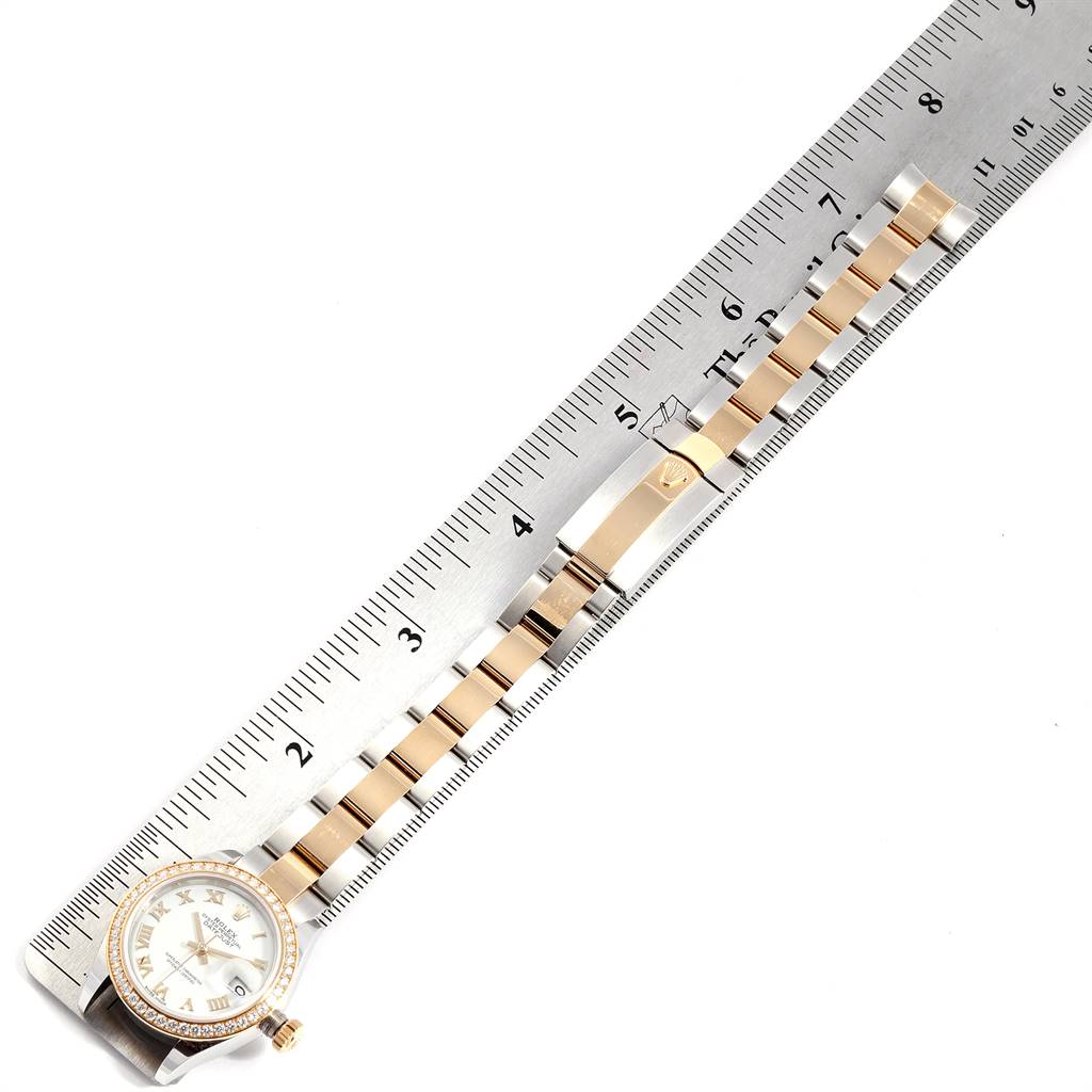 The image shows a Rolex Datejust 279383 Women's Steel and Gold (two tone) White Dial 279383 Women's Steel and Gold (two tone) White Dial model watch, highlighting its dial and bracelet, positioned next to a ruler for measurement.