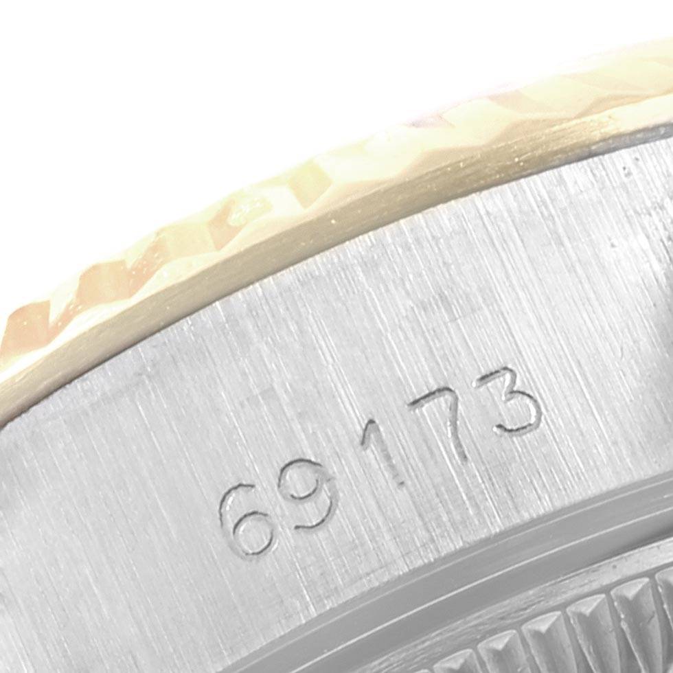 This close-up image shows the side of a Rolex Datejust 69173 Women's Stainless Steel Black Dial 69173 Women's Stainless Steel Black Dial watch, displaying the engraved model number 69173.