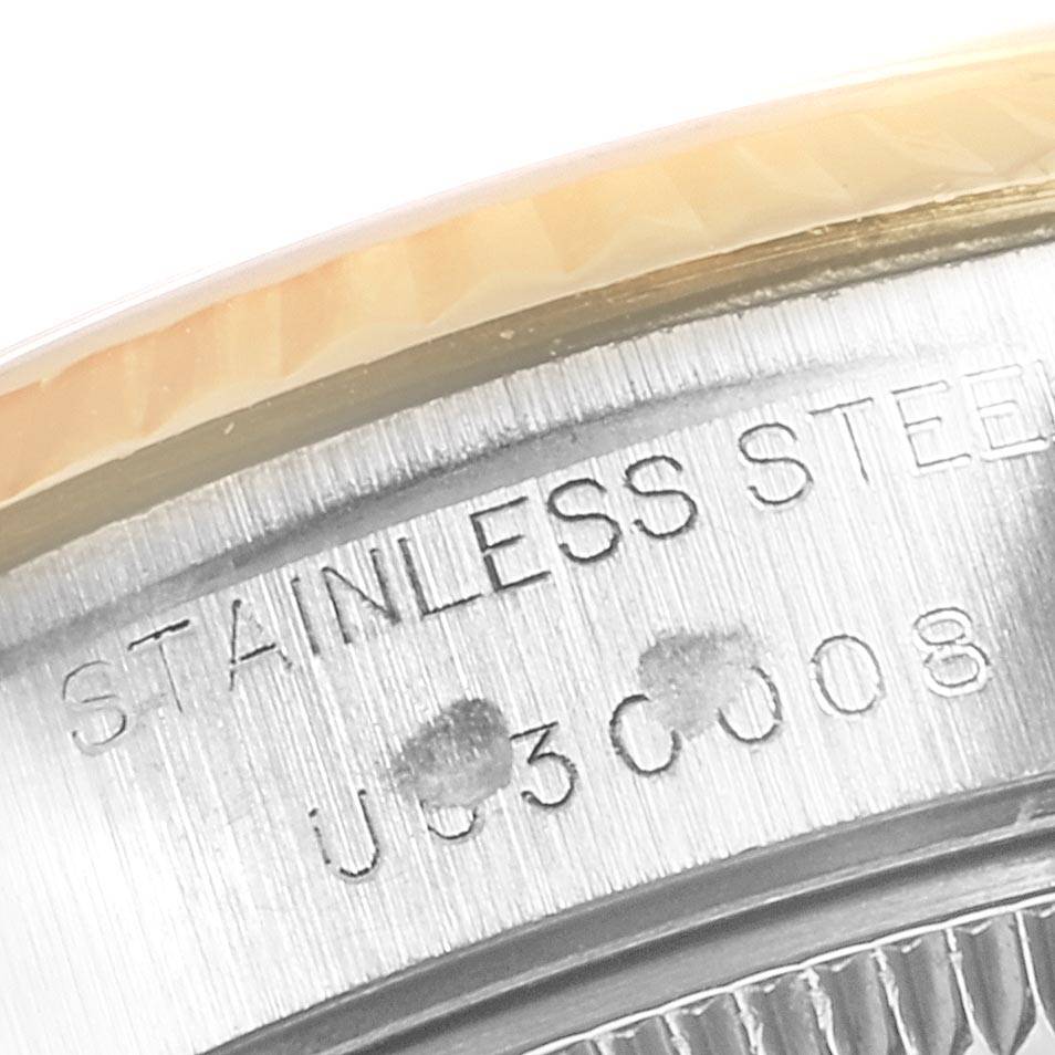 This image shows a close-up of the case side and bezel part of a Rolex Datejust 69173 Women's Stainless Steel Mother of Pearl Dial 69173 Women's Stainless Steel Mother of Pearl Dial, highlighting the "STAINLESS STEEL" engraving.
