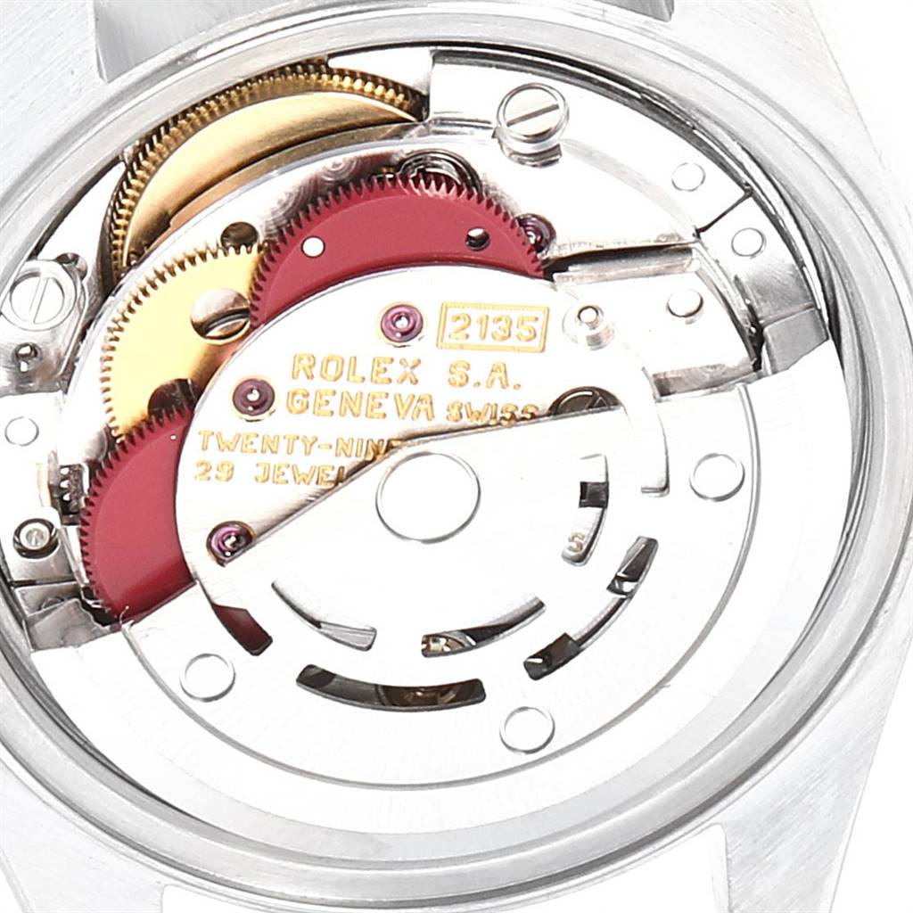 The image shows the movement mechanism of the Rolex Datejust 69173 Women's Stainless Steel Mother of Pearl Dial 69173 Women's Stainless Steel Mother of Pearl Dial watch, highlighting gears and the rotor.