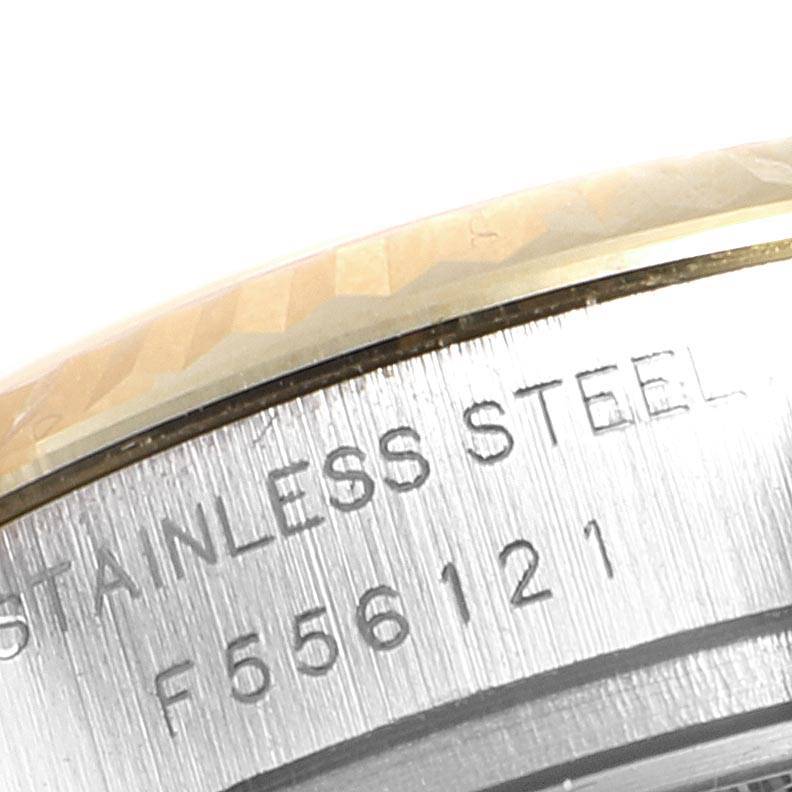 This image shows an engraved stainless steel case side of a Rolex Datejust 179173 Women
s Steel and Gold (two tone) Mother of Pearl Dial 179173 Women
s Steel and Gold (two tone) Mother of Pearl Dial model.