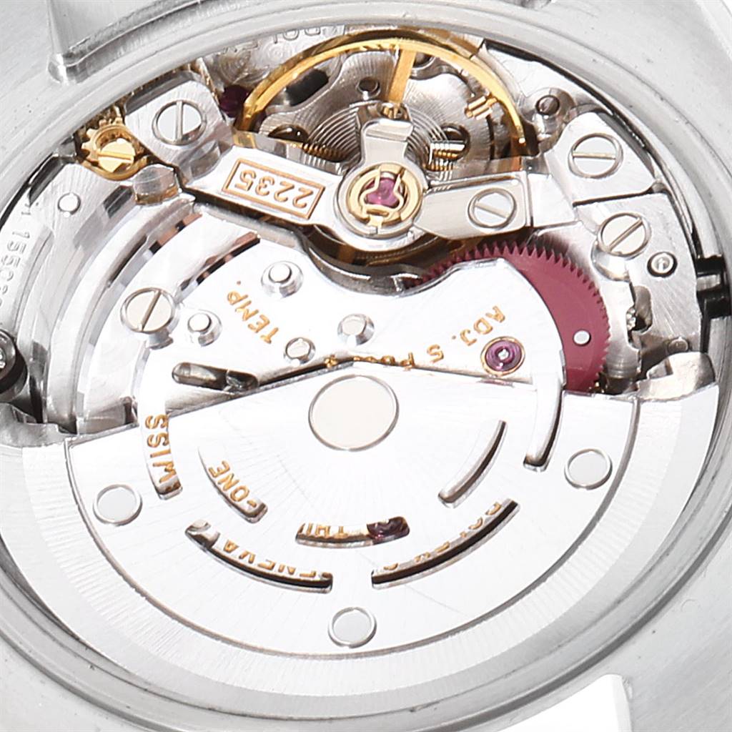 This image shows a close-up of the movement mechanism of a Rolex Datejust 179173 Women
s Steel and Gold (two tone) Mother of Pearl Dial 179173 Women
s Steel and Gold (two tone) Mother of Pearl Dial watch, highlighting its intricate parts and details.