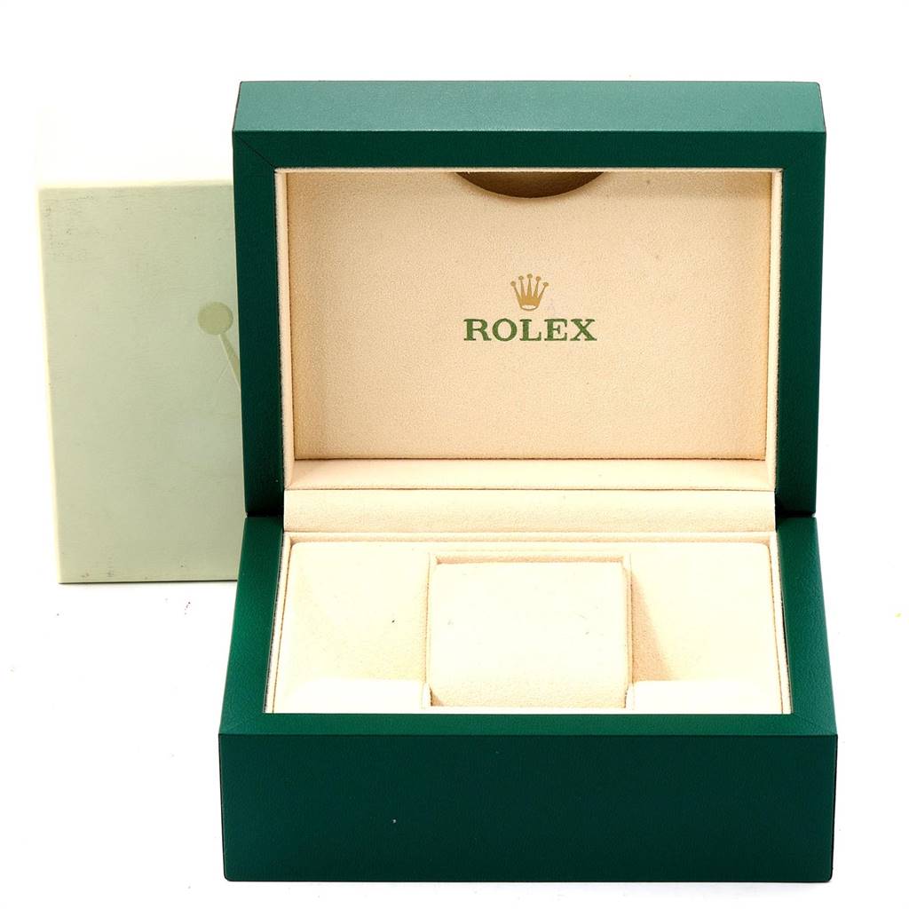 The image shows an open green and beige Rolex Datejust 179173 Women
s Steel and Gold (two tone) Mother of Pearl Dial 179173 Women
s Steel and Gold (two tone) Mother of Pearl Dial watch box from a front angle, without the watch inside.