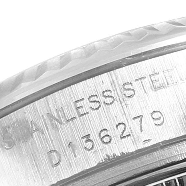 Close-up of the serial number engraving and part of the bezel on a Rolex Datejust 179174 Women
s Stainless Steel Silver Dial 179174 Women
s Stainless Steel Silver Dial watch.